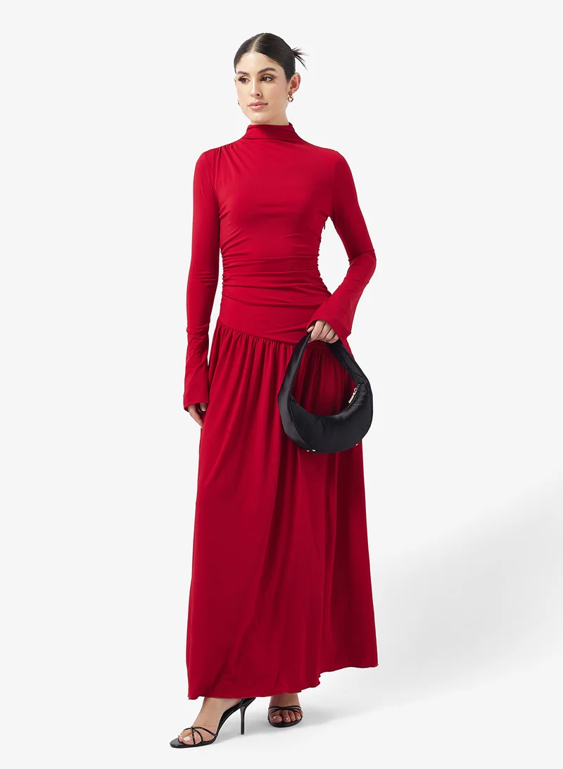 بريتي لافيش فستان ماكسي من جيرسي بشراشيب شاي